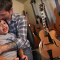 Musician Jason Truby greets his son Elijah in his Little Rock studio. Truby played in the popular Ch...