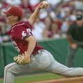 Washington State's James Wise pitches against Arkansas during an NCAA college baseball tournament re...