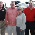 Jeanne and Arkansas Air Museum director Warren Jones, from left, and museum supporters Ron and Debbi...