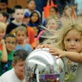 Elizabeth Johnson, 3, gets a little nervous Saturday while volunteering during a science experiment ...