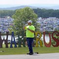 Volunteer Joe Gardner mans the front entrance Saturday of the Wakarusa music festival at Mulberry Mo...
