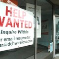 FILE - In this June 3, 2010 file photo, a help wanted sign fills a window at an AT&T cell phone stor...