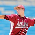   University of Arkansas pitcher Drew Smyly fires a pitch in the 4th inning of Thursday afternoon's...