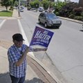 Anthony Clark of Fayetteville holds a sign Tuesday supporting Lt. Gov. Bill Halter, a Democrat, for ...