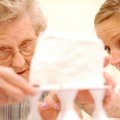 Catherine Taylor of Farmington, right, gets some help from Jane Maloney of Fayetteville in assemblin...