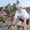 Shelby Werner of Springdale, foreground, zips along old U.S. 71 during a Saturday morning ride with ...