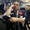 FILE - In this May 25, 2010 file photo, trader Albert Young, center, watches the numbers on the floo...