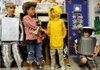 ENERGY WIZARDS 0 Steven Simmermon, 10, left, Jackson Thompson, 10, Cash Zimmerly, 10, and Corbett Martin, 10, act out a skit Thursday about energy conservation and themed after “The Wizard of Oz” in their classroom at R.E. Baker Elementary School in Bentonville. The boys’ fourth-grade class, taught by Phyllis Abraham, was named the winner of Johnson Controls’ Igniting Creative Energy Challenge for their efforts in becoming better stewards of the environment.
