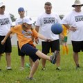 KICK IT! - Abbi Lane, 10, of Bentonville kicks the ball into play Thursday while pinch-hitting for W...
