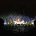 Spectators watch the premiere of World of Color water show at Disneyland in Anaheim, Calif., in Anah...