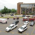 Fayetteville emergency personnel work Thursday in a parking lot north of the John Paul Hammerschmidt...