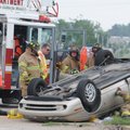 TWO-CAR COLLISION - Emergency personnel work to free Ethel Bromley of 804 N. 13th St. on Thursday in...