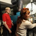 Ellen Bowling and her son, Jimmy, 
switch lenses on the projector before the start of “Prince of Pe...