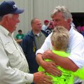 Gov. Mike Beebe speaks with Henry Williams, left, while consoling Williams' sister-in-law outside Mi...