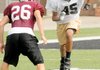 Bentonville receiver Desmond Smith sprints downfield against Jenks, Okla., during a football camp Friday in Tiger Stadium in Bentonville.
