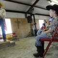 Ethan Hooper, 7, of Gateway listens as Cross Brand Cowboy Church pastor Tim Wallace talks to childre...