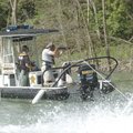 WET WORK - Cpl. Rick Holland with the Benton County Sheriff’s Office shoots a rifle Friday from a bo...