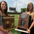 Bentonville’s Meg McGuirt, left, and Alex Sullivan hold some of the trophies they helped win while p...