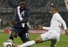 The United States’ Jozy Altidore (left) competes for the ball with England’s Ashley Cole during their World Cup match Saturday. The teams played to a 1-1 tie.