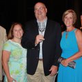Jim Collins of Frie Brothers Reserve, center, visits with Walton Arts Center CEO Peter and Bobbie La...