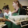 In this file photo from July 20, 2006, Lisa Scritchfield, center, serves banana nut loaf to guests a...