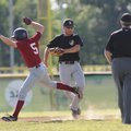 Springdale Harps’ Tyler Turknett, left, is tagged out by Bentonville second baseman Kameron Poole in...