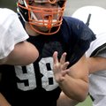 Rogers Heritage defensive lineman Kevin Rivers tries to break through the line of scrimmage against ...