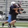 Gentry’s Tanner Morgan, right, tries to haul in a pass while being covered by Springdale Har-Ber’s J...