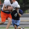 Rogers Heritage’s Luke Oldham, catches the ball as Springdale Har-Ber’s Pedro Ortuno defends during ...