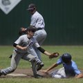 Fayetteville’s Carson Shaddy tags out Springdale Har-Ber’s Logue Chancellor at second base Tuesday i...