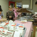 Zachary Walkup, 9, left, grabs a carton of juice Tuesday to go along with his breakfast as Bonnie Ma...
