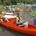 Eric Elliott and his wife, Allie Elliott, of Bella Vista try out a canoe assisted by Bruce Jenkins, ...