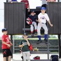 Kids attending the Balls-N-Strikes youth baseball camp take a break for lunch Wednesday at Tyson Par...