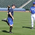  Lloyd Simmons, right, an amateur scout with the Kansas City Royals, watches an athlete sprint to th...