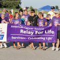 FIGHT AGAINST CANCER - Caregivers join the ranks of cancer survivors Friday for the second lap of th...