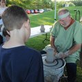 TAKING FORM - Terry Biggs of Bella Vista makes a pot Thursday as part of the Jerusalem Marketplace a...