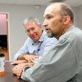 Chris Hart, right, talks about his own road to recovery before a Recovery For Life ministry meeting ...