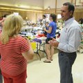 GREAT GIVE-AWAY - Lafe Caton, right, talks with Linda Frazier at the second community giveaway at th...