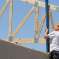 PLUMB STRAIGHT - Lynn Schumpert with VMCC of Bella Vista checks a truss for plumb Friday on the futu...