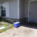 Blood trails lead into a house at 1712 S. H St. in Rogers where two men were stabbed after a fight e...