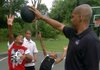 Corliss Williamson with sons Creed, Chasen and C.J. on the basketball court behind his house.
