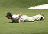 Nathan J. Smith, the first- and second-round leader, gets low to check the line for his putt on the 18th green. Despite the move, Smith missed the putt to fall a shot behind leader Josh Broadaway.