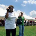  Friends Katherine Williams, left, and Denice Nelson sing and dance Saturday with the Arkansas Gospe...