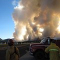 Fire crews watch as a wildfire burns north of Flagstaff, Ariz., Sunday, June 20, 2010. 