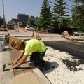 Aaron Wood, lead maintenance worker for the Fayetteville Transportation Division, places custom-cut ...