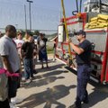 Jeremy Ashley, a Fayetteville firefighter, demonstrates how a pole hook is used Monday during the fi...