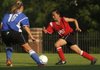 Gentry’s Adora Lee attempts to get past Searcy’s McKenzie Clark on Tuesday during the Arkansas High School Coaches Association All-Star Girls Soccer Match in Fayetteville.