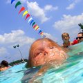 Kiera Mahmans, 8, comes up for breath after a cool dip underwater during Tuesday afternoon’s 92-degr...
