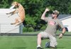 Mike Kittinger of Prairie Village, Kan., practices Saturday with his dog Henry for the freestyle competition at
the Bigwag Dog Bakery Arkansas State Disc Dog Championship in Bentonville.