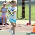 Jaclyn Yarborough, 7, practices her backhand Tuesday at Northwest Park in Rogers. Jaclyn was with a...